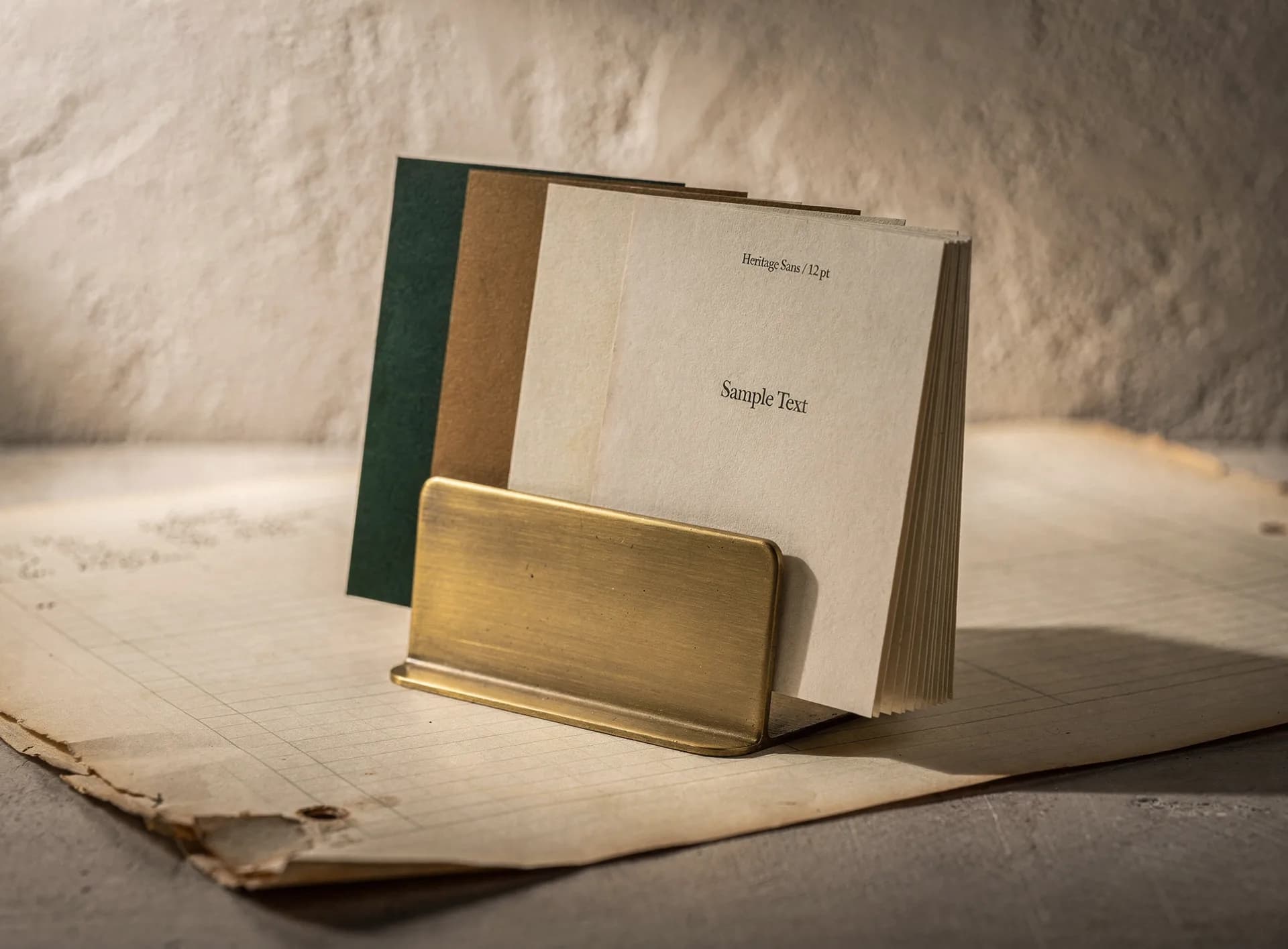 Layered style-sample swatches presented on a brass display stand